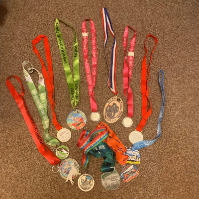 Hannah's 12 medals of the 12 events she ran this year.