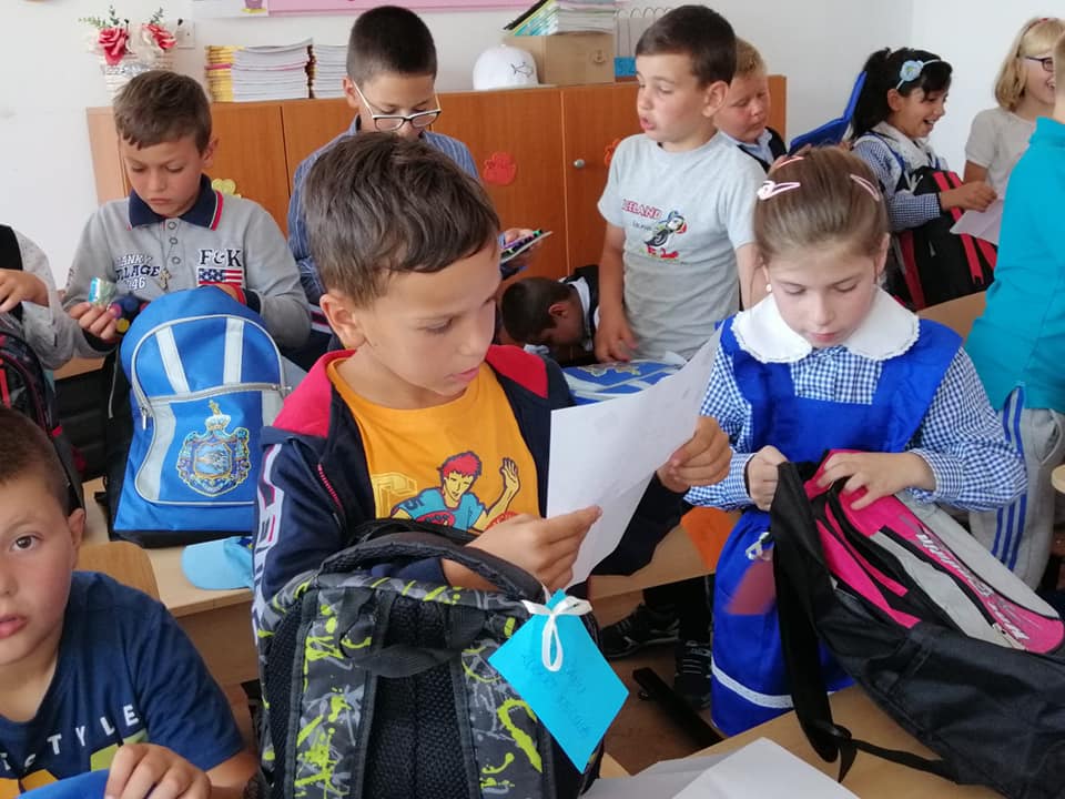 School children opening their new bags