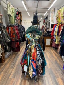 up close of a mannequin wearing a colourful vintage dress