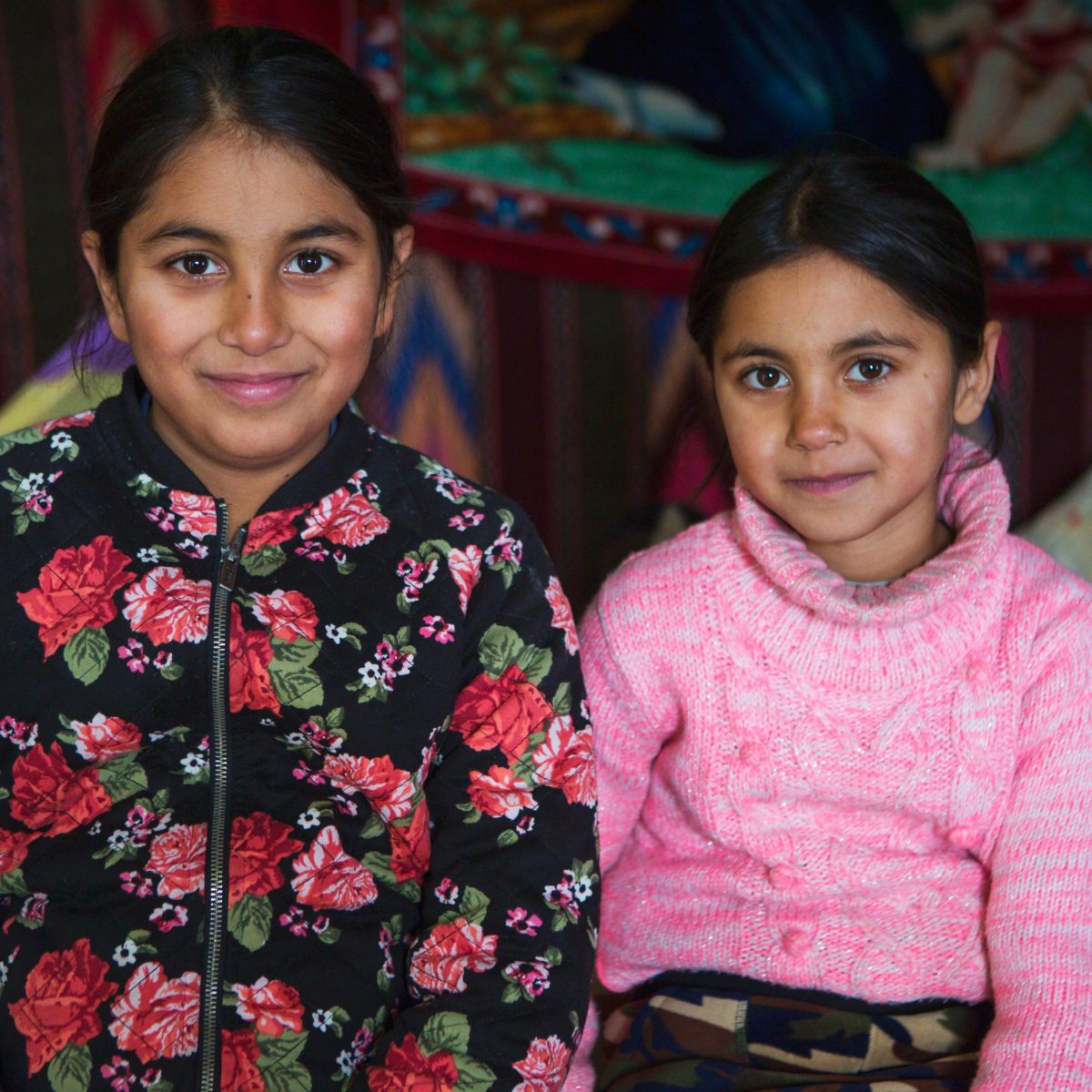 Sisters sitting in their home in Northern Romania