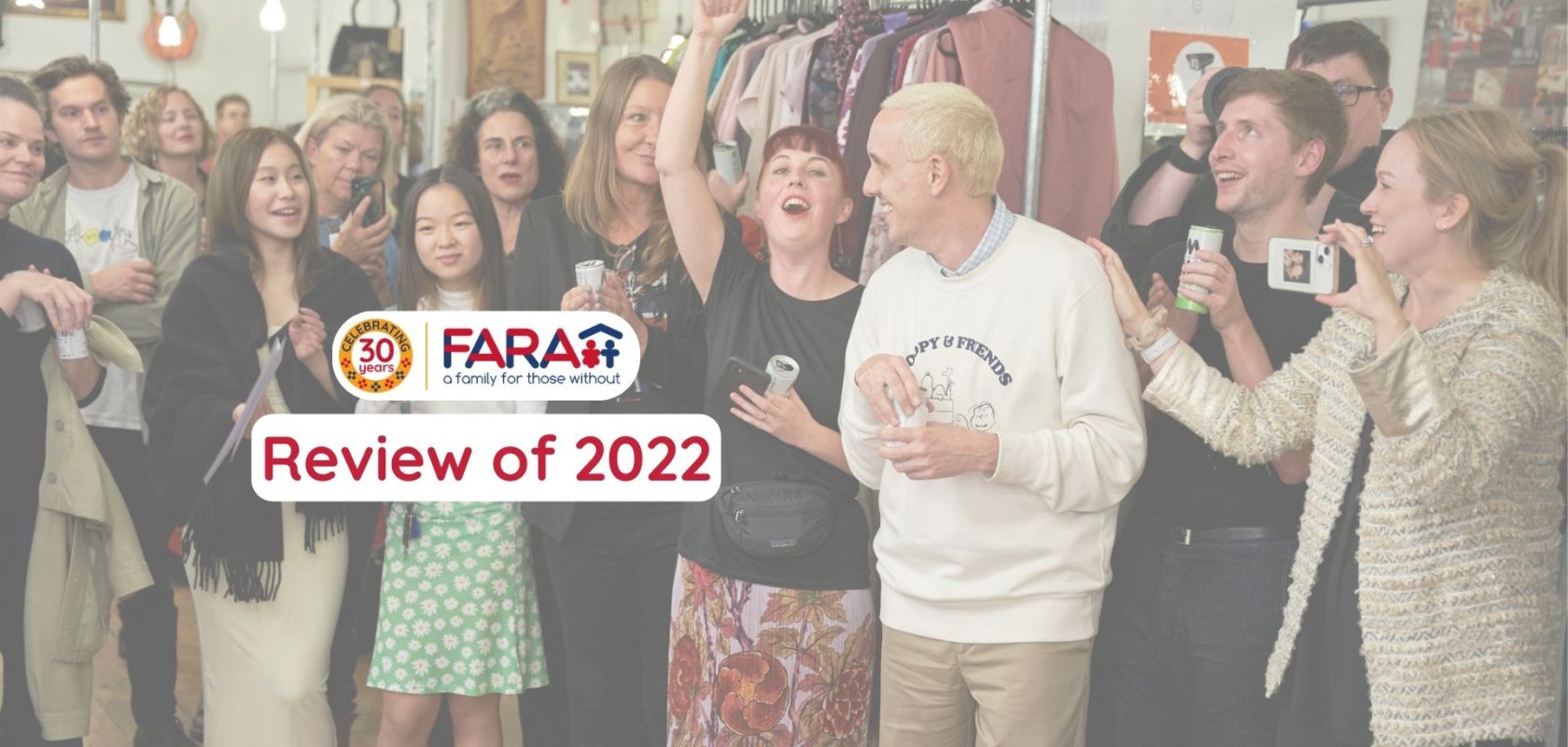 Group of London College of fashion students, FARA charity employees and trustees all celebrating an event at FARA charity shop in Islington