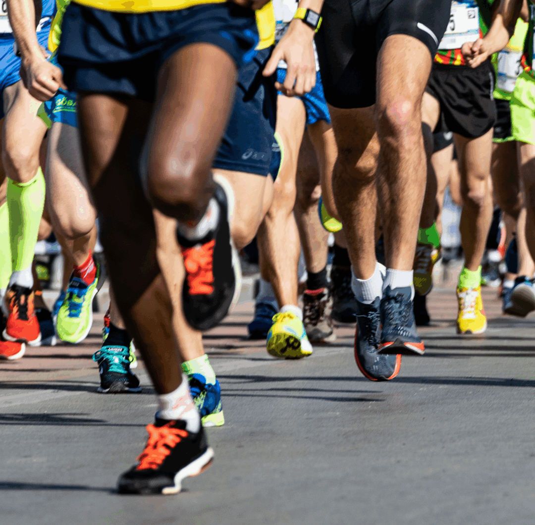 shot of lots of runners from the waist down wearing gym kit and trainers